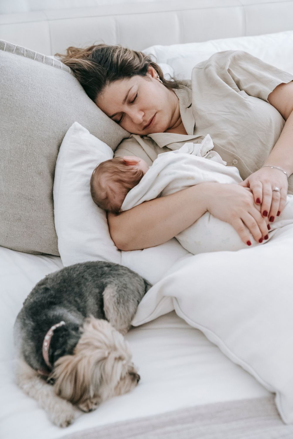 A sleeping baby napping peacefully on a parent's chest during a contact nap